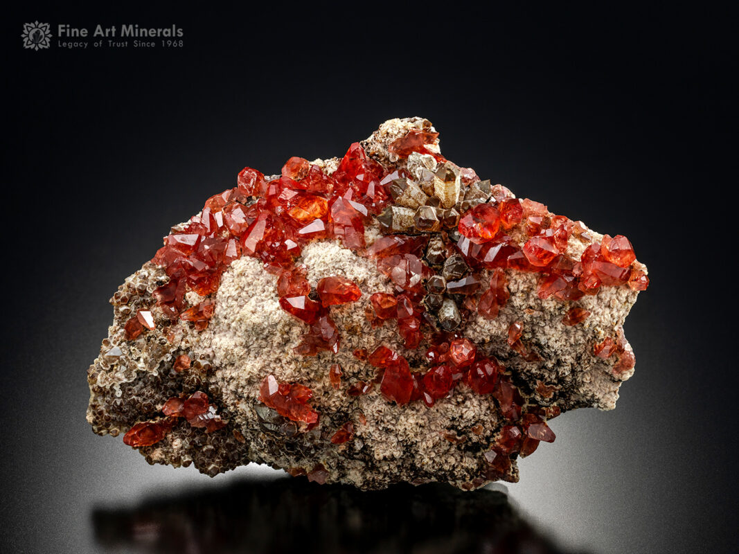 A magnificent fine specimen features a rhodochrosite cluster from Peru.