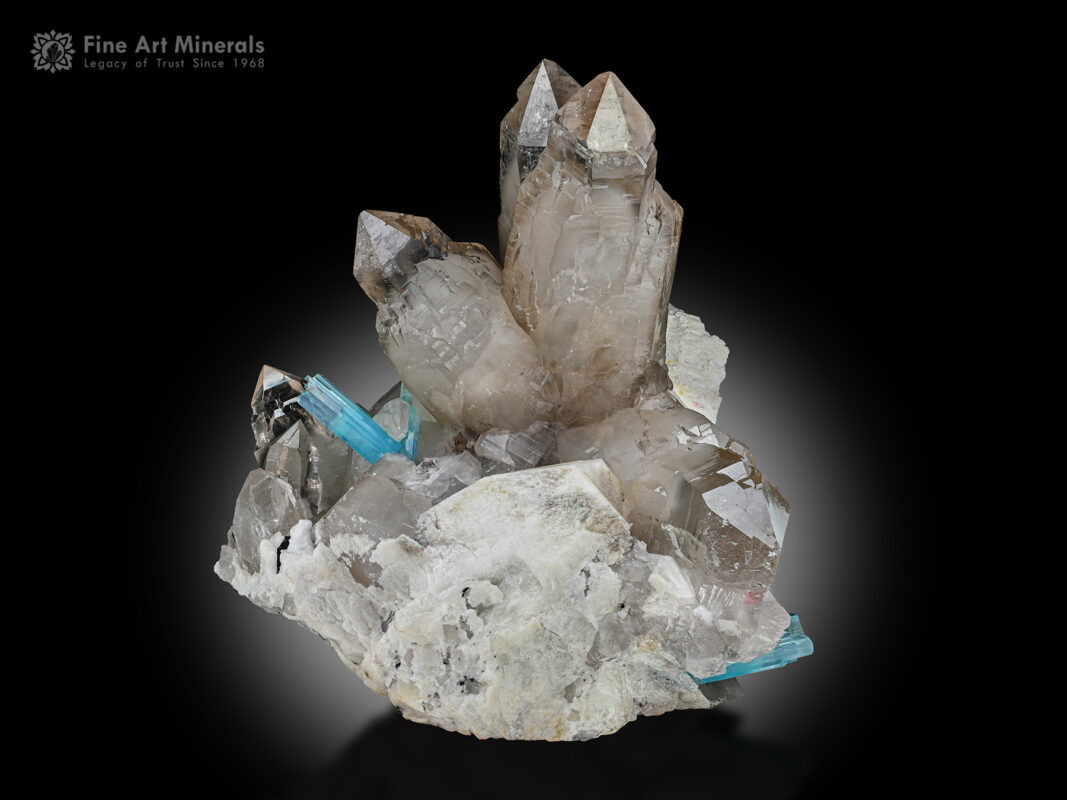 A massive museum-grade decorative specimen of smoky quartz with aquamarine and feldspar from Pakistan.