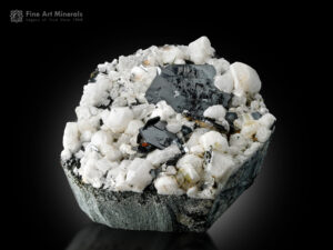 Glossy metallic-black hematite crystals with adularia from Shigar Valley, Skardu District, Pakistan.