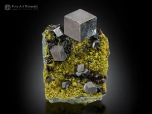 Sharp and lustrous andradite garnet crystal 3 cm across on a matrix of epidote and clinochlore from Marki Khel, Nangarhar, Afghanistan.