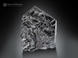 Hematite specimen showing bold step-growth, sharp termination on one side, and reflective metallic luster