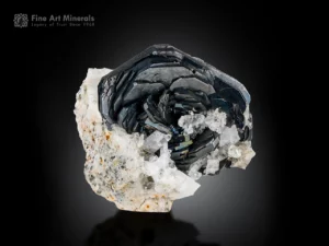 Hematite rosette crystals with white adularia on complex rock matrix, showing metallic luster and subtle iridescence.