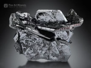 Hematite specimen showing intergrown crystals with reflective steel-gray luster and sharp geometric growth