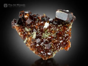 Andradite garnet cluster 4.5 cm with 1.5 cm crystal, sharp geometry, superb luster, and excellent condition.