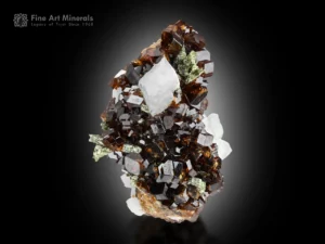 Sharp andradite garnet crystals with excellent luster, green epidote, and white feldspar from Pakistan, exhibiting strong color contrast and aesthetic appeal.