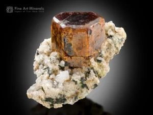 Sharp lustrous bastnäsite crystal with reddish-brown color on matrix with aegirine crystals from Zagi Mountain, Pakistan