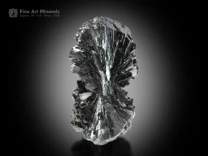 Single bow-tie Epidote crystal from Kharan, Pakistan — miniature specimen with lustrous reflective surfaces.