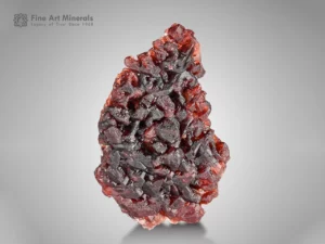 Spessartine Garnet from Shengus, Pakistan — small cabinet specimen with fiery red-orange color and etched surfaces.
