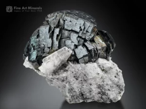 Hematite on matrix – lustrous steel-gray hematite with albite from Tormiq Valley, Pakistan.