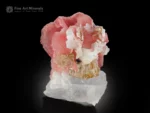 Rhodochrosite with Quartz and Albite from Shigar Valley, Pakistan — small cabinet specimen with sharp-bladed pink crystals.