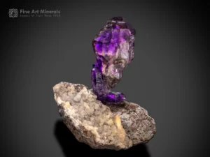 Amethyst crystal with scepter habit showing purple color zoning and smoky transitions on matrix from Brandberg, Namibia