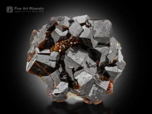Dark honey-brown andradite garnet with sharp luster and geometric symmetry.