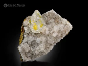 Transparent quartz crystal with yellow petroleum inclusions on white quartz matrix from Balochistan, Pakistan.