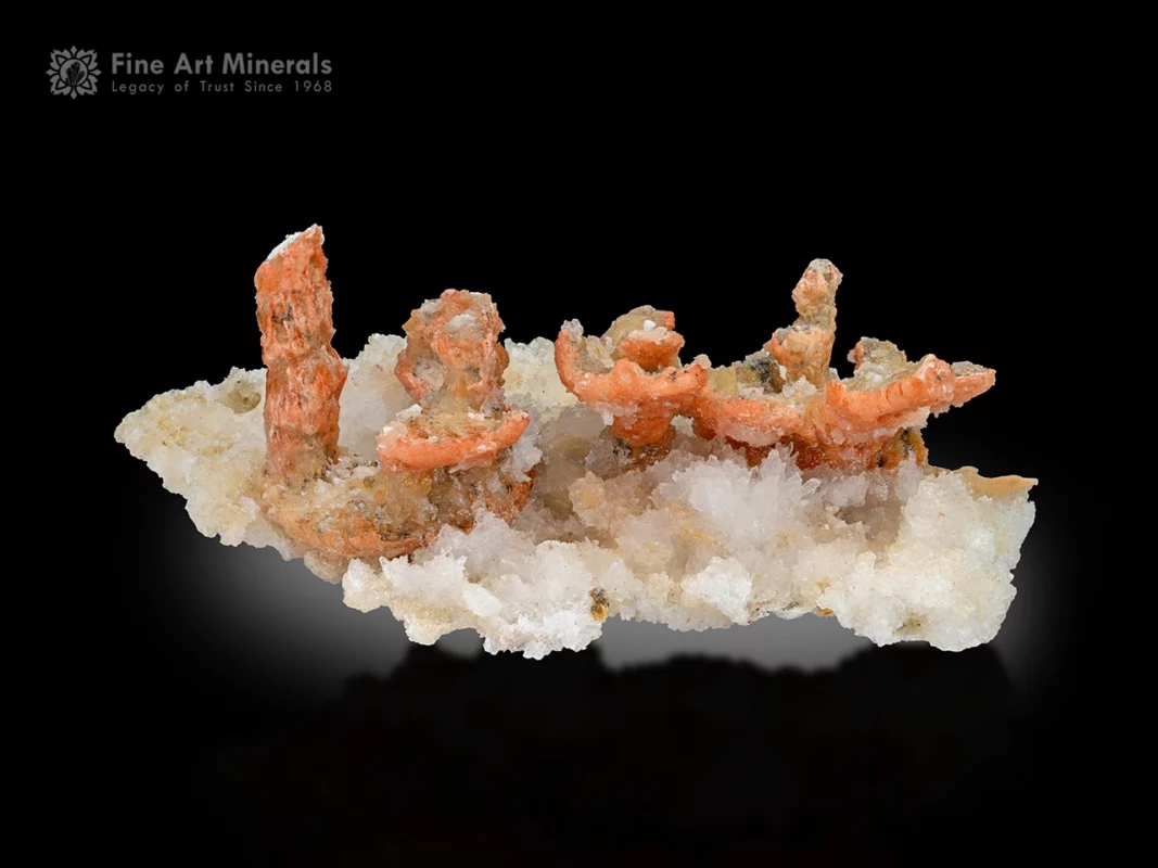 Fine calcite crystals with peach-orange tones and frosty white luster on bright matrix from Wenshan Mine, Yunnan, China.