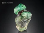 Fine emerald crystal showing vivid green color, bright luster, and sharp edges on natural matrix from Swat, Pakistan