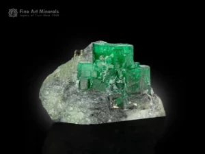 Emerald crystals with pyrite on gray and white matrix from Swat, Pakistan.