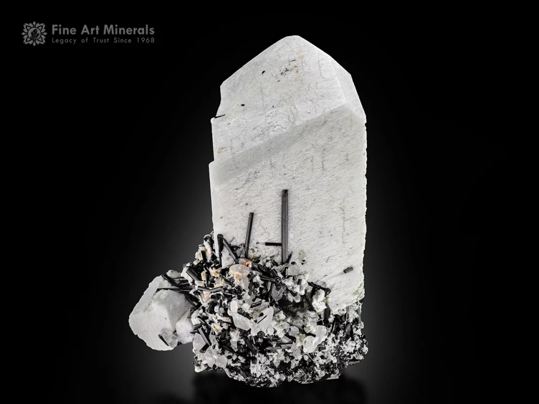 Large feldspar crystal with black schorl and quartz.