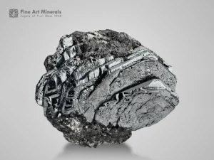 Sharp metallic hematite crystal with mirror-like reflections.