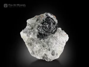 Metallic hematite crystal cluster on white matrix.