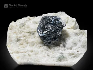 Metallic hematite crystal on white matrix.