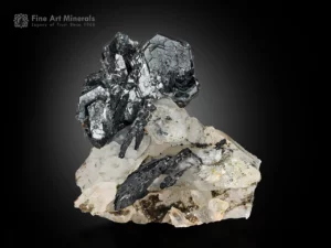 Metallic hematite crystals on a clear quartz matrix.