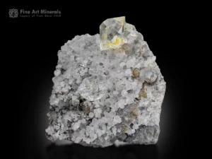 Clear quartz crystals with yellow petroleum inclusions and calcite from Balochistan, Pakistan.