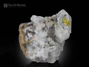 Clear petroleum quartz with yellow oil inclusions and calcite on matrix from Buhirmas, Pakistan.