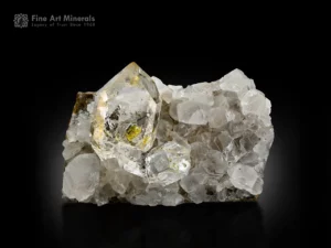Transparent petroleum quartz crystals with yellow inclusions on a calcite matrix from Buhirmas, Balochistan, Pakistan.