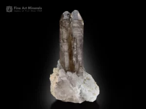 Smoky window quartz crystals with sharp terminations, bright luster, and clear zoning on matrix.