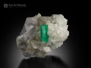 Gemmy 1.9 cm doubly terminated Colombian emerald crystal on quartz and albite matrix with vivid green color and bright luster.