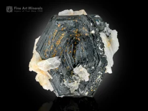 Hematite crystals with albite from Pakistan showing sharp twinning and strong luster.