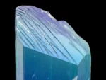 Natural kunzite crystal displaying vivid blue and green color zoning with bright clarity and textured termination.