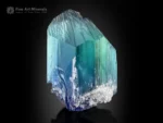 Natural kunzite crystal displaying vivid blue and green color zoning with bright clarity and textured termination.