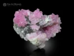Rose quartz cluster on a smoky quartz matrix from Dara-i-Pech, Afghanistan, with a delicate pink color and strong luster.