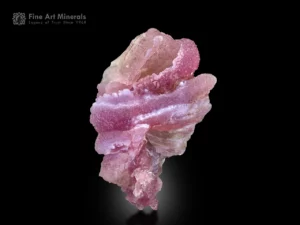 Rose quartz on smoky quartz with rich pink color and layered sculptural formation from Afghanistan.