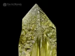 Transparent yellow spodumene var. triphane crystal with etched termination and glassy luster.