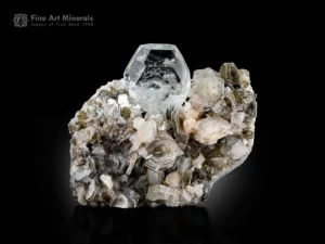 Gemmy transparent goshenite crystal with apatite and muscovite on natural matrix