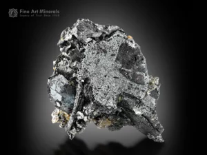 Metallic hematite specimen with albite crystals, subtle sagenite patterns, and mica accents.