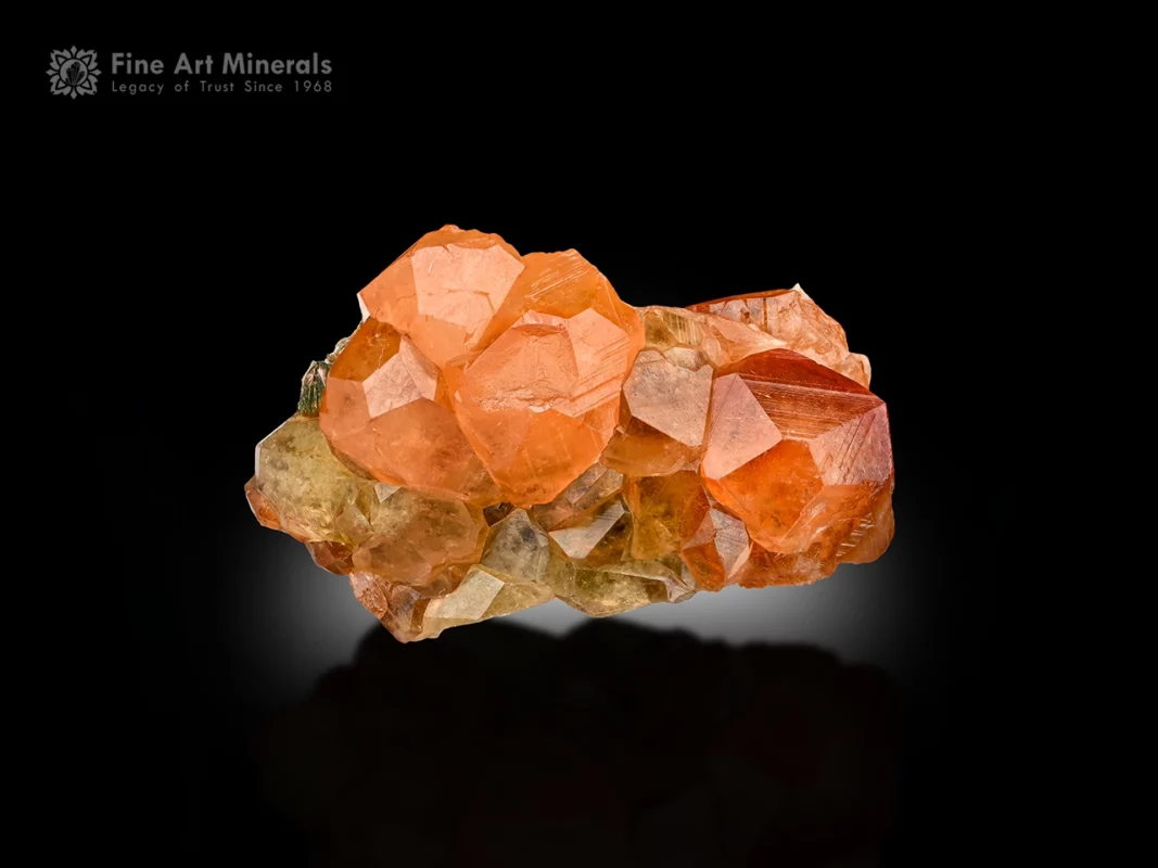 Honey orange hessonite garnet with bright luster and subtle mica from Pakistan.