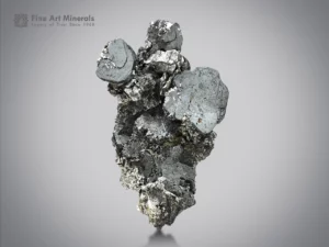 Metallic hematite discs with sagenite, mica, and albite accents from Pakistan.