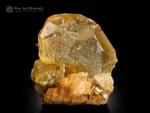 Warm-toned gemmy fluorite crystal on muscovite matrix from Pakistan