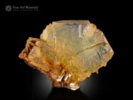 Warm-toned gemmy fluorite crystal on muscovite matrix from Pakistan