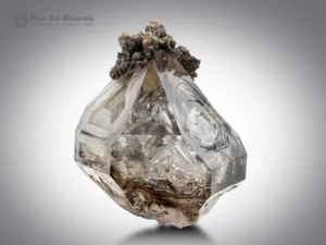 Window quartz crystal with prominent fenster faces, albite association, and chlorite spray from Namibia