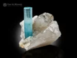 Gemmy aquamarine crystal with sharp termination on lustrous quartz and albite matrix.