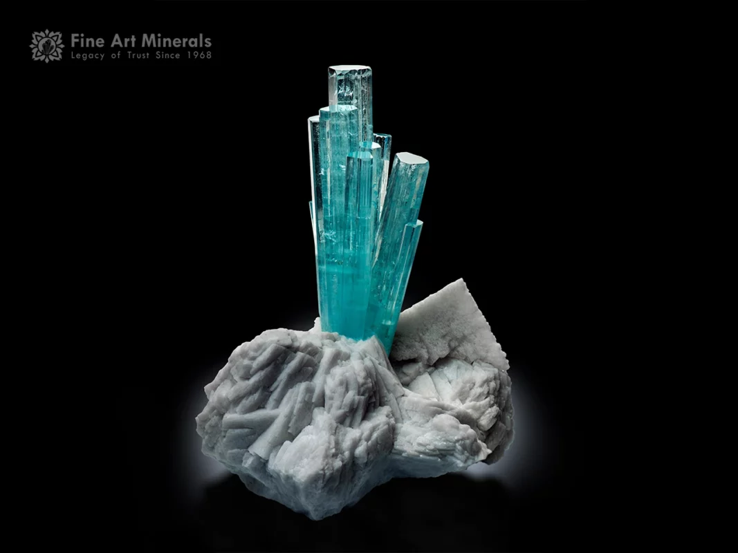 Museum-grade aquamarine crystal cluster with sky blue crystals on white albite matrix