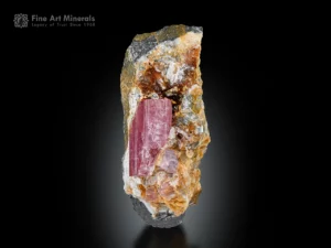 Pink topaz crystal on matrix from Pakistan with attractive pink color and strong vertical striations
