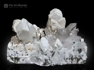 Large decorative specimen featuring blocky feldspar crystals associated with clear quartz, black schorl, and white albite on a massive matrix