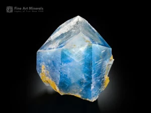 Sky blue celestine crystal with sharp termination on yellow calcite matrix.
