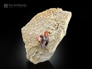 Reddish brown brookite crystal cluster with quartz on a light textured matrix