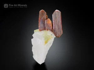 Reddish brown brookite crystals with sharp terminations on a white quartz matrixReddish brown brookite crystals with sharp terminations on a white quartz matrix